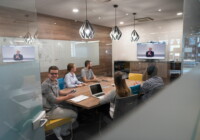start up business people group attending videoconference call with senior investitior at modern office