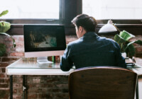 Photographer editing a photo at the desk